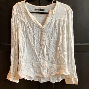 Long sleeve white blouse.